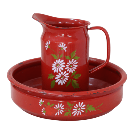 A vintage red enamelware washbasin set